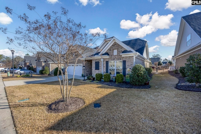 view of front of home featuring a front lawn, a garage, brick siding, and driveway