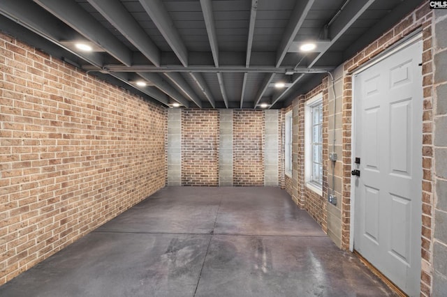 basement with brick wall