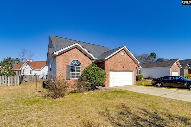 view of front of house featuring brick siding, an attached garage, a front lawn, fence, and driveway