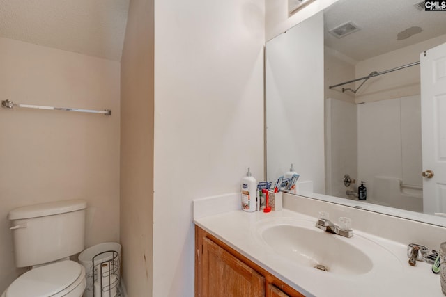 full bathroom with visible vents, a textured ceiling, toilet, and vanity