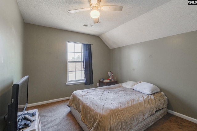 bedroom with baseboards, visible vents, carpet floors, ceiling fan, and vaulted ceiling