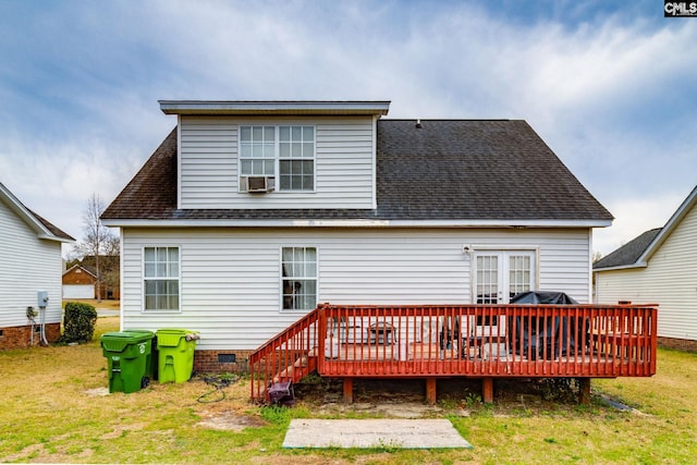 rear view of property featuring crawl space, a yard, a wooden deck, and roof with shingles