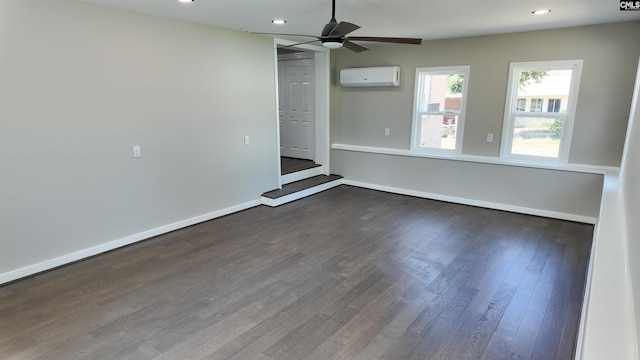 empty room featuring baseboards, dark wood finished floors, a wall mounted air conditioner, recessed lighting, and a ceiling fan