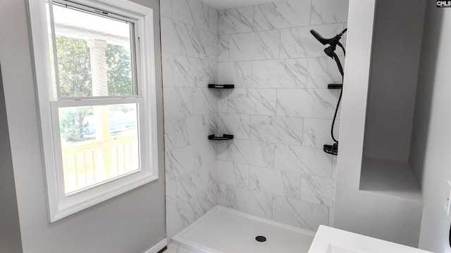 bathroom with a tile shower