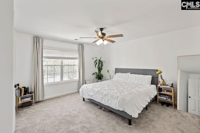 bedroom featuring visible vents, carpet floors, and ceiling fan