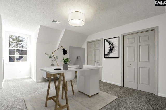 dining space with visible vents, light colored carpet, a textured ceiling, and lofted ceiling