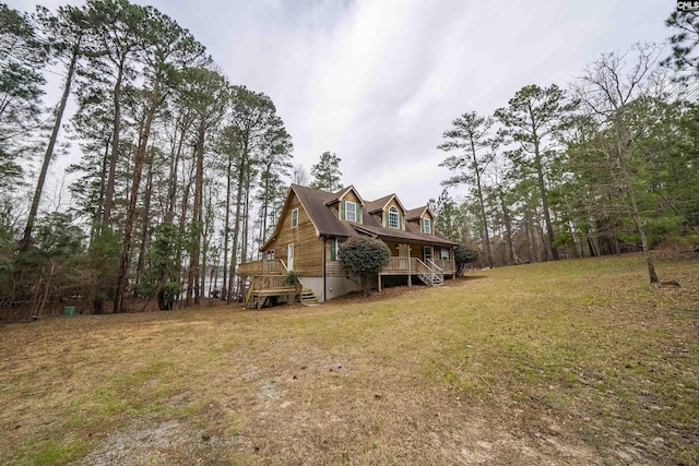 view of side of property with a lawn