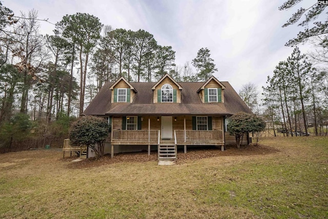 view of front of property featuring covered porch and a front yard