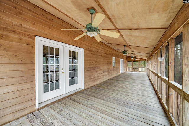 wooden deck featuring a ceiling fan and french doors