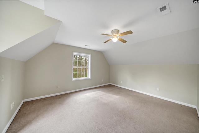 additional living space featuring visible vents, baseboards, and ceiling fan