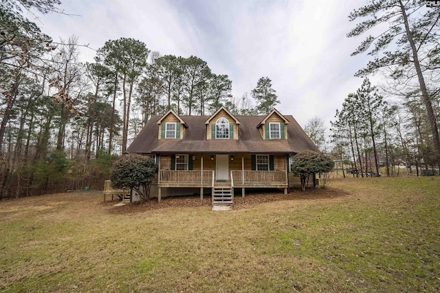 view of front of house featuring a front lawn and covered porch