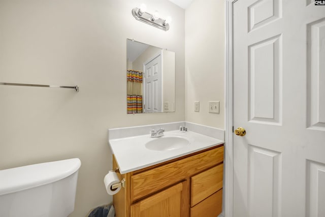 full bath with vanity and toilet