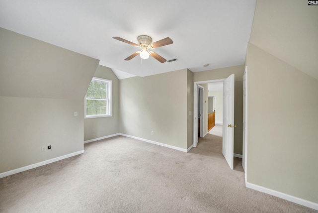 additional living space featuring visible vents, baseboards, carpet flooring, and a ceiling fan