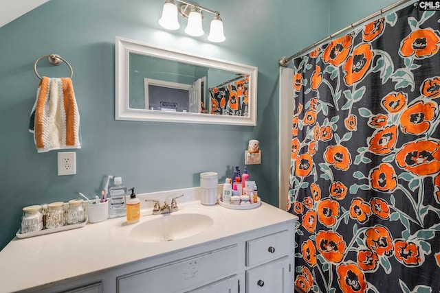 bathroom with a shower with curtain and vanity