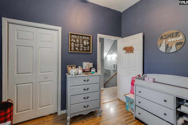 bedroom featuring a closet and light wood finished floors