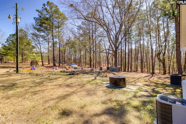 view of yard featuring central AC unit