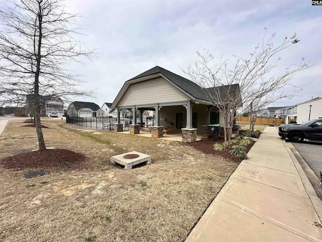 bungalow-style house featuring a patio and fence