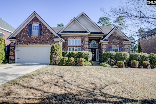 craftsman house with concrete driveway, a garage, brick siding, and a front lawn