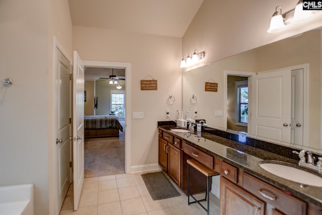 full bathroom with tile patterned flooring, double vanity, connected bathroom, and a sink