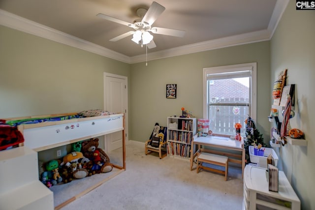 carpeted bedroom featuring crown molding and a ceiling fan