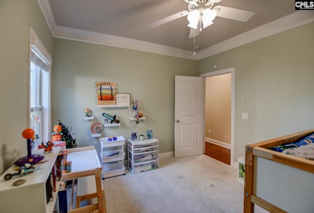 bedroom featuring a ceiling fan, baseboards, carpet floors, and ornamental molding