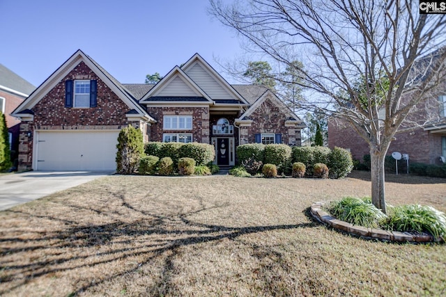 view of front of property with a garage, brick siding, and driveway