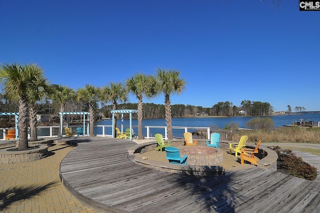 dock area with a water view and a pergola