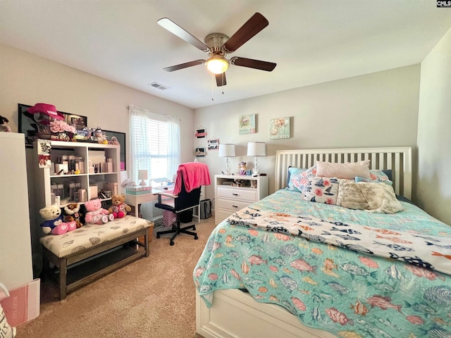 bedroom with a ceiling fan, visible vents, and light carpet