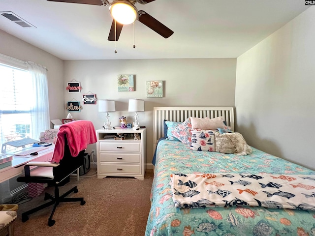 carpeted bedroom with visible vents and ceiling fan