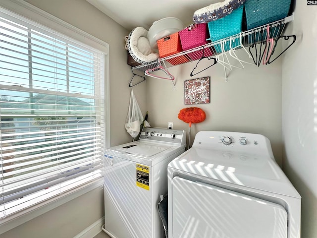 washroom with laundry area and washer and clothes dryer