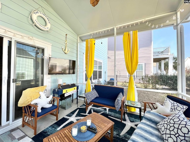 sunroom / solarium with lofted ceiling