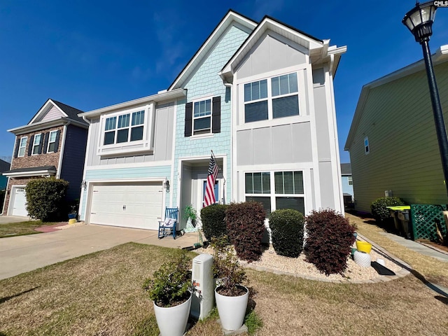 view of front of property with driveway, a garage, and board and batten siding