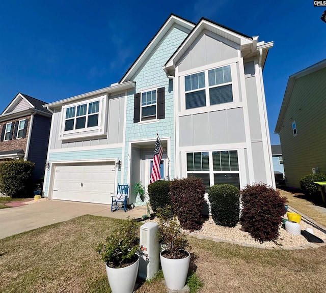 view of front of property with an attached garage, concrete driveway, and board and batten siding