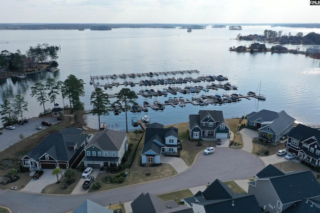 aerial view featuring a residential view and a water view