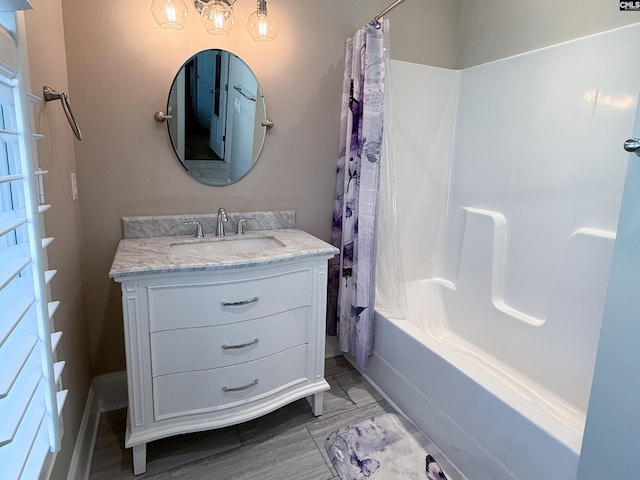 bathroom with shower / bath combo and vanity