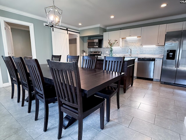 dining space featuring recessed lighting, an inviting chandelier, a barn door, and ornamental molding