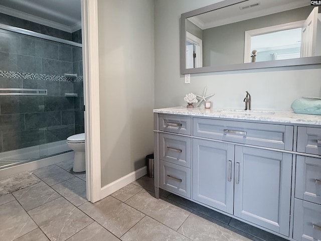 bathroom with visible vents, toilet, a stall shower, ornamental molding, and vanity