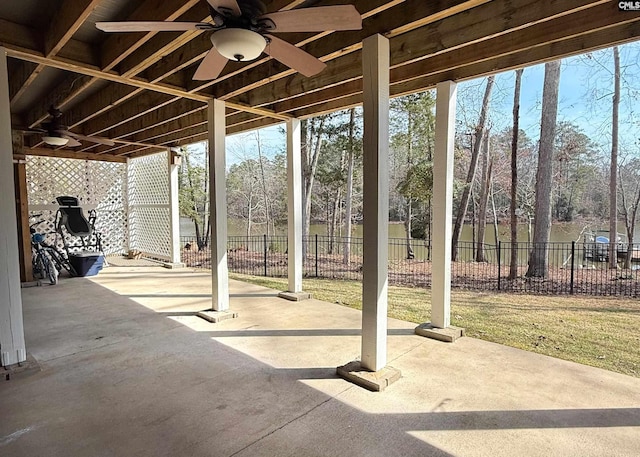 view of patio featuring a ceiling fan and fence