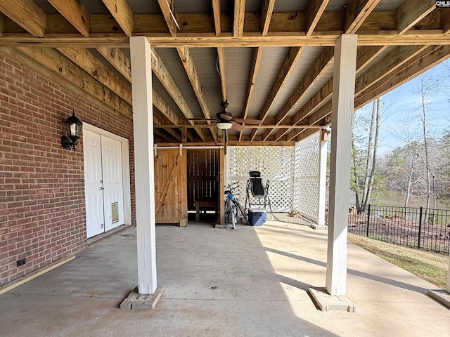 view of patio / terrace featuring fence and ceiling fan