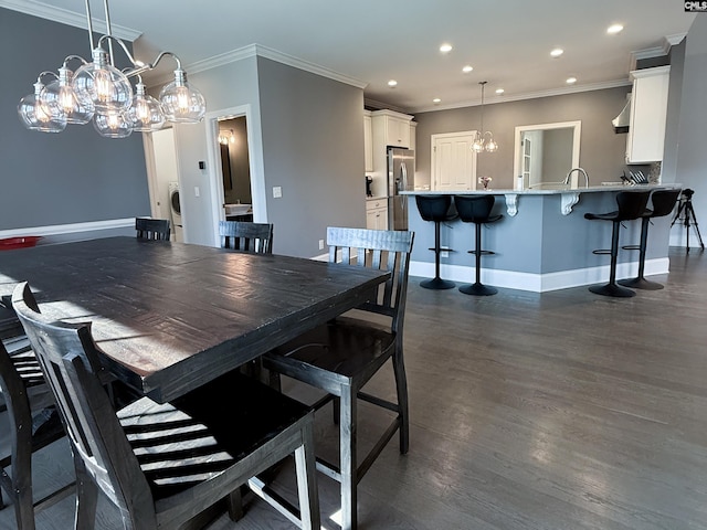 dining area with baseboards, dark wood finished floors, recessed lighting, crown molding, and a notable chandelier