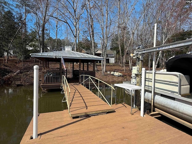 dock area featuring a water view and boat lift