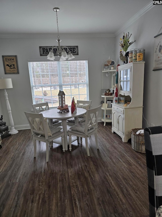 dining room with baseboards, an inviting chandelier, dark wood-style floors, and crown molding