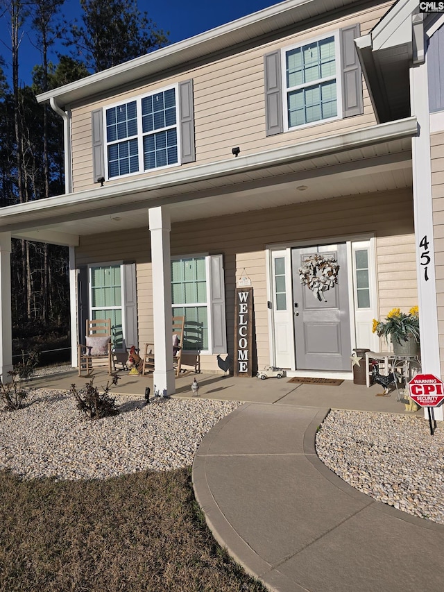 entrance to property with a porch