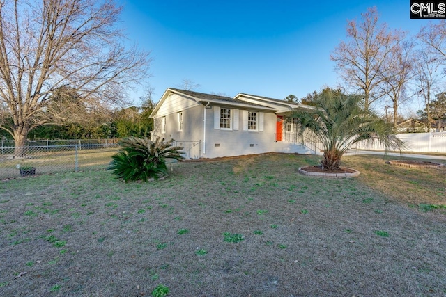 view of front of home featuring crawl space, a fenced backyard, and a front lawn