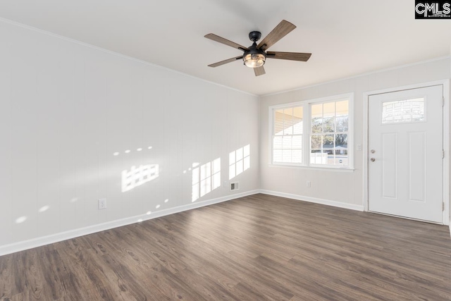 interior space featuring visible vents, dark wood finished floors, a ceiling fan, and crown molding