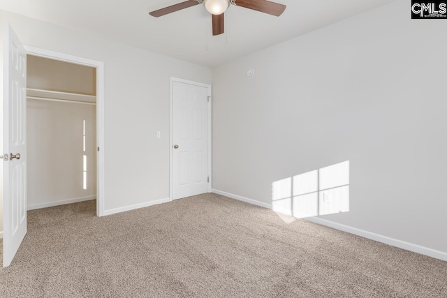 unfurnished bedroom with baseboards and carpet flooring