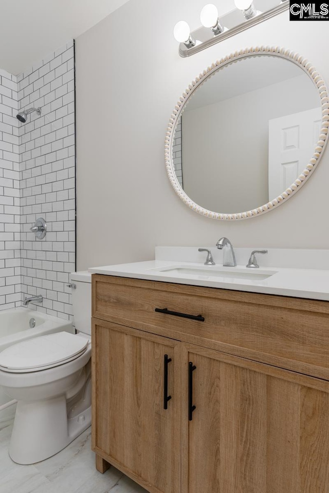 full bathroom featuring vanity, toilet, washtub / shower combination, and marble finish floor