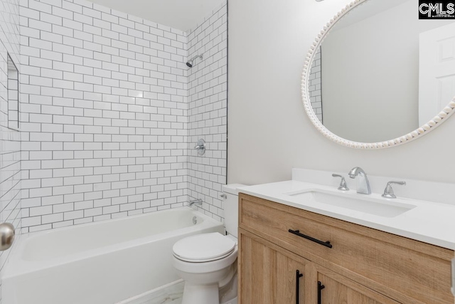 full bath featuring toilet, vanity, and washtub / shower combination