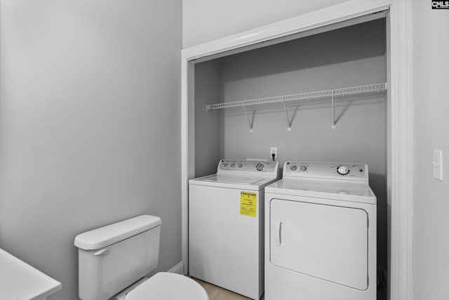 laundry area with independent washer and dryer