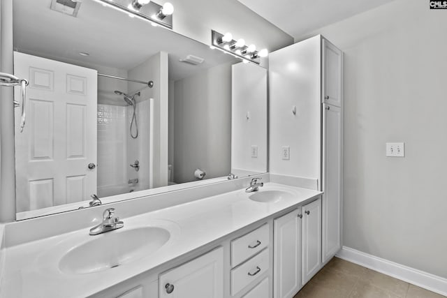 full bathroom with tile patterned floors, visible vents, toilet, and a sink